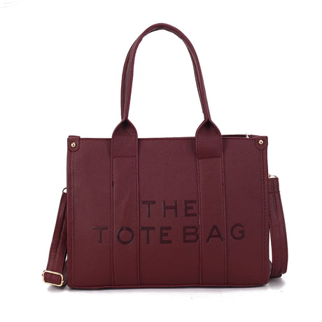 MEDIUM EMBOSSED THE TOTE BAG