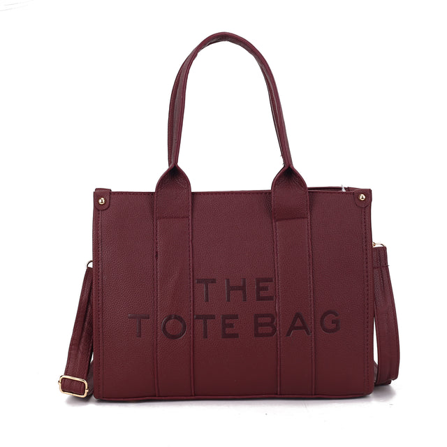 MEDIUM EMBOSSED THE TOTE BAG