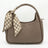 Brown handbag with a matching checkered scarf on a white background