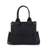 SMALL EMBOSSED THE TOTE BAG